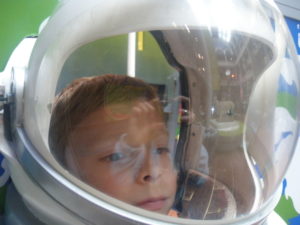 The gift of science: day out at the Scottish National Museum of Science || Used with permission—all rights reserved: afmaxwell Image of child in spacesuit helmet with Dolly the sheep reflected in the background